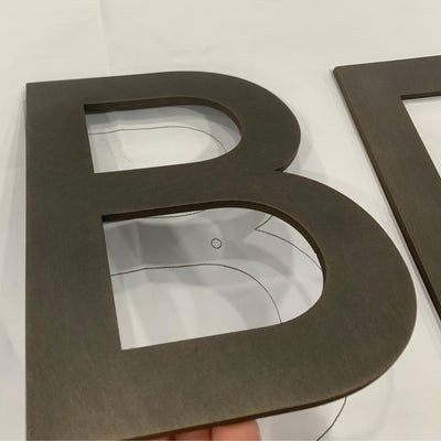 SSL electroplated bronze random grain letter